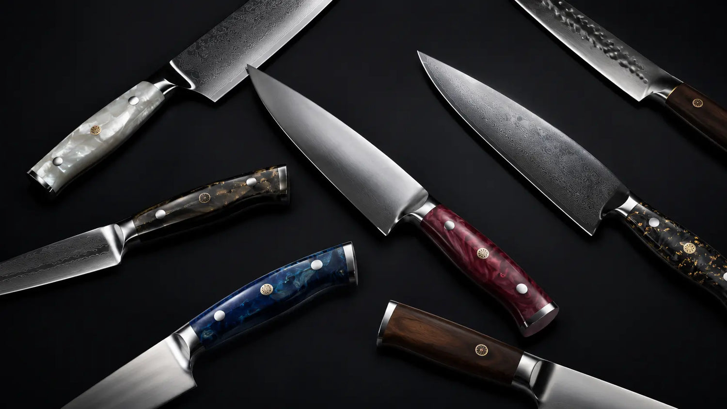 Japanese Damascus kitchen knives with colorful handles on a dark background