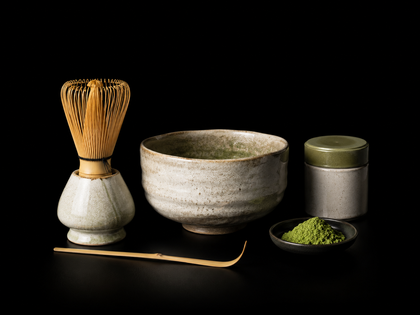 Japanese matcha set with ceramic tea bowl, bamboo whisk and matcha powder